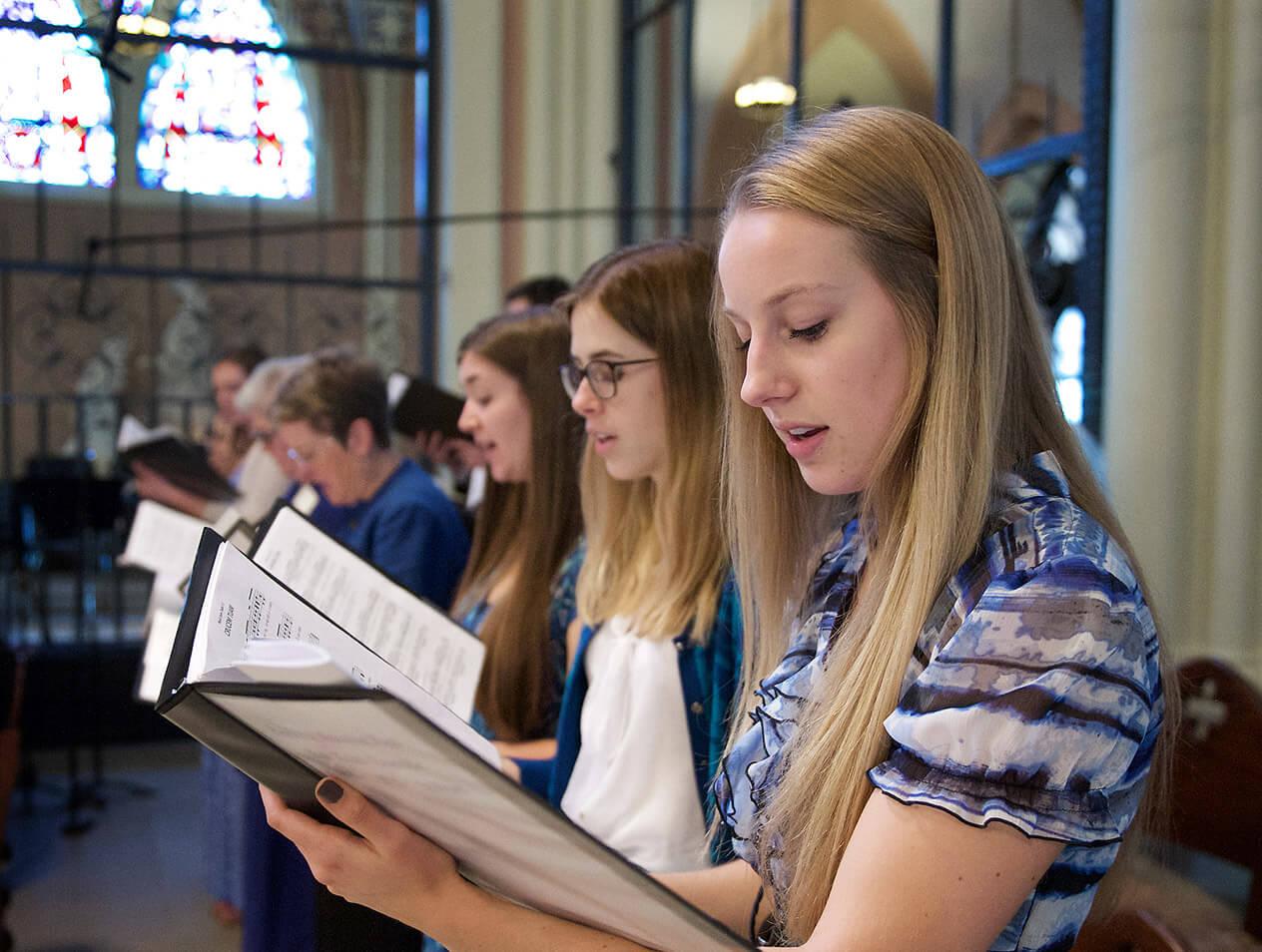 Choir members singing during Mass