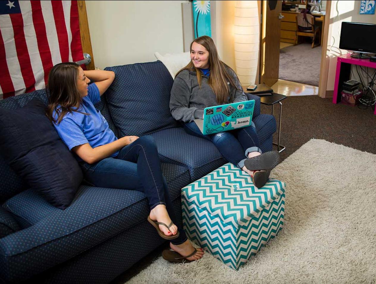 Friends studying in living room setting